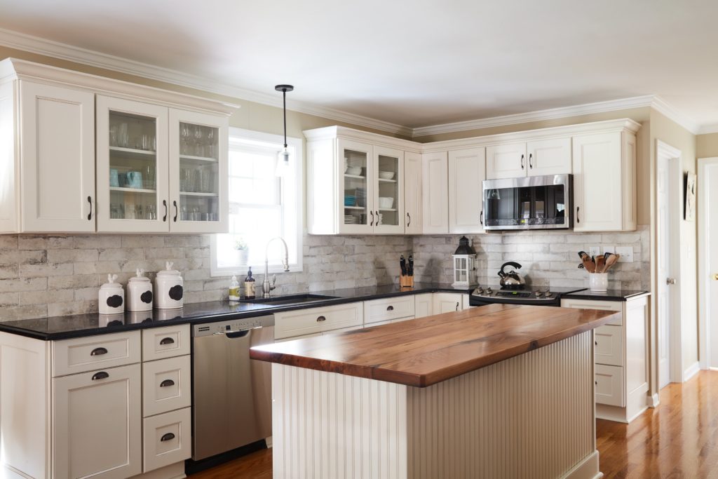 A white kitchen cabinet developed by kyle cabinetry