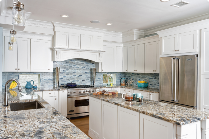 A customer kitchen featuring white kitchen cabinets